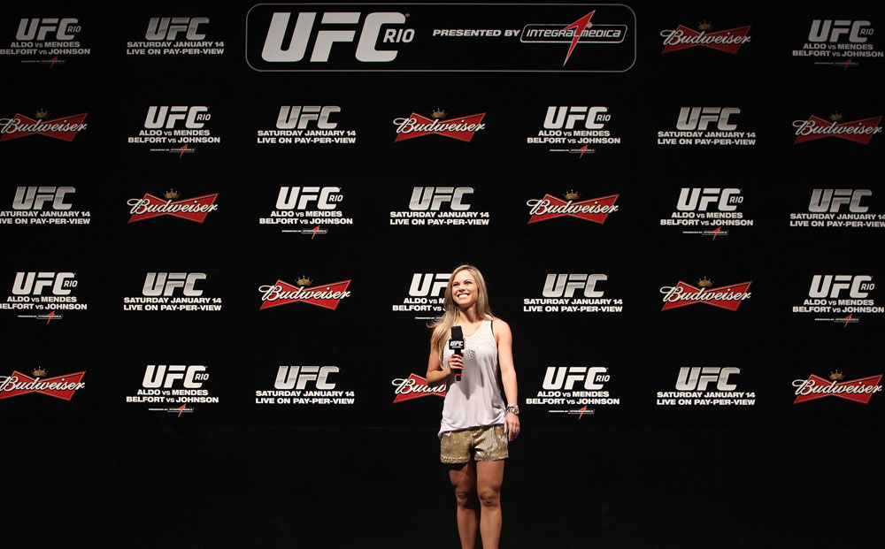 RIO DE JANEIRO, BRAZIL - JANUARY 13: UFC Brazil host Paula Sack conducts a Q&A session with UFC Heavyweight Champion Junior dos Santos before the UFC 142 Weigh In at HSBC Arena on January 13, 2012 in Rio de Janeiro, Brazil. (Photo by Josh Hedges/Zuffa LLC/Zuffa LLC via Getty Images)