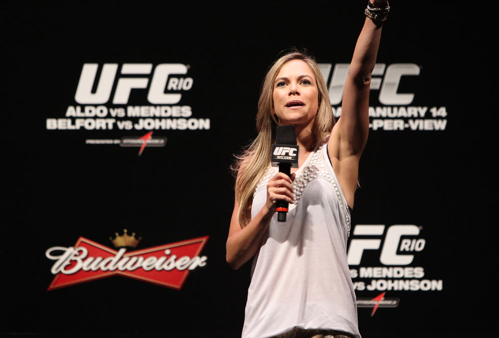 RIO DE JANEIRO, BRAZIL - JANUARY 13: UFC Brazil host Paula Sack conducts a Q&A session with UFC Heavyweight Champion Junior dos Santos before the UFC 142 Weigh In at HSBC Arena on January 13, 2012 in Rio de Janeiro, Brazil. (Photo by Josh Hedges/Zuffa LLC/Zuffa LLC via Getty Images)