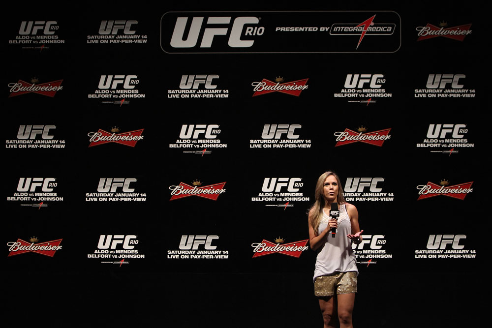 RIO DE JANEIRO, BRAZIL - JANUARY 13: UFC Brazil host Paula Sack conducts a Q&A session with UFC Heavyweight Champion Junior dos Santos before the UFC 142 Weigh In at HSBC Arena on January 13, 2012 in Rio de Janeiro, Brazil. (Photo by Josh Hedges/Zuffa LLC/Zuffa LLC via Getty Images)