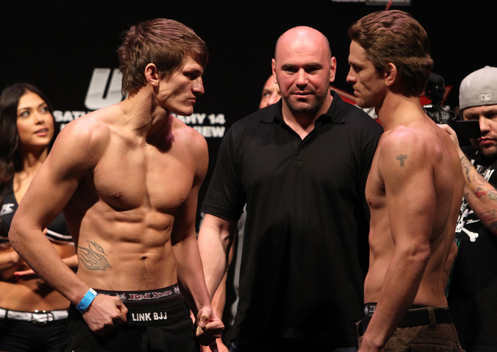 RIO DE JANEIRO, BRAZIL - JANUARY 13:  (L-R) Opponents Ricardo Funch and Mike Pyle face off after weighing in during the UFC 142 Weigh In at HSBC Arena on January 13, 2012 in Rio de Janeiro, Brazil.  (Photo by Josh Hedges/Zuffa LLC/Zuffa LLC via Getty Images)