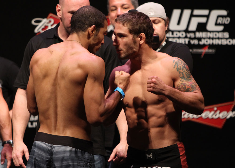 RIO DE JANEIRO, BRAZIL - JANUARY 13: (L-R) UFC Featherweight Champion Jose Aldo and challenger Chad Mendes face off after weighing in during the UFC 142 Weigh In at HSBC Arena on January 13, 2012 in Rio de Janeiro, Brazil. (Photo by Josh Hedges/Zuffa LLC/Zuffa LLC via Getty Images)