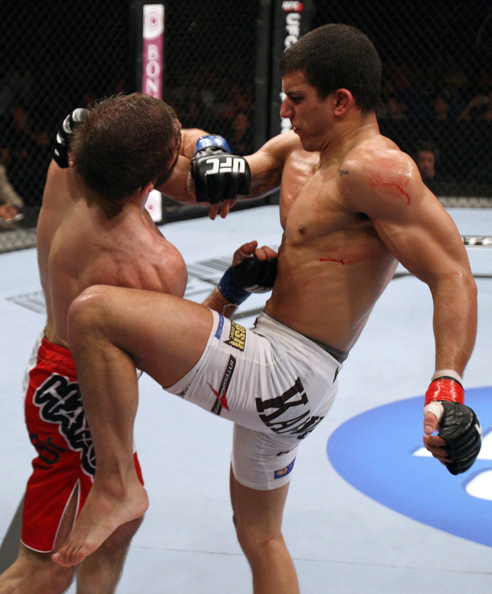 RIO DE JANEIRO, BRAZIL - JANUARY 14:  Felipe Arantes knees Antonio Carvalho in a featherweight bout during UFC 142 at HSBC Arena on January 14, 2012 in Rio de Janeiro, Brazil.  (Photo by Josh Hedges/Zuffa LLC/Zuffa LLC via Getty Images)