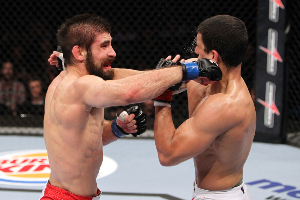 RIO DE JANEIRO, BRAZIL - JANUARY 14: Antonio Carvalho (L) punches Felipe Arantes (R) in a featherweight bout during UFC 142 at HSBC Arena on January 14, 2012 in Rio de Janeiro, Brazil. (Photo by Josh Hedges/Zuffa LLC/Zuffa LLC via Getty Images)