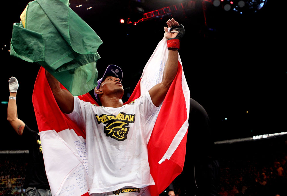 RIO DE JANEIRO, BRAZIL - JANUARY 14: Yuri Alcantara celebrates after defeating Michihiro Omigawa in a featherweight bout during UFC 142 at HSBC Arena on January 14, 2012 in Rio de Janeiro, Brazil. (Photo by Josh Hedges/Zuffa LLC/Zuffa LLC via Getty Images)