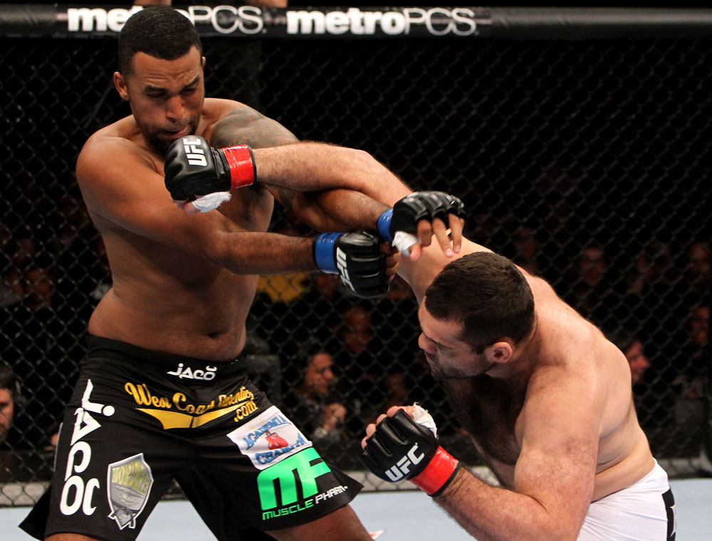 RIO DE JANEIRO, BRAZIL - JANUARY 14: Gabriel Gonzaga (R) and Ednaldo Oliveira (L) exchange punches in a heavyweight bout during UFC 142 at HSBC Arena on January 14, 2012 in Rio de Janeiro, Brazil. (Photo by Josh Hedges/Zuffa LLC/Zuffa LLC via Getty Images)
