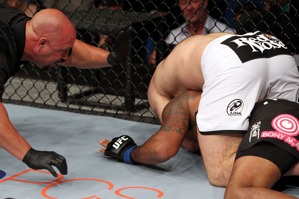 RIO DE JANEIRO, BRAZIL - JANUARY 14: Referee Dan Miragliotta (L) looks on as Gabriel Gonzaga (Top) chokes out Ednaldo Oliveira (Bottom) in a heavyweight bout during UFC 142 at HSBC Arena on January 14, 2012 in Rio de Janeiro, Brazil. (Photo by Josh Hedges/Zuffa LLC/Zuffa LLC via Getty Images)
