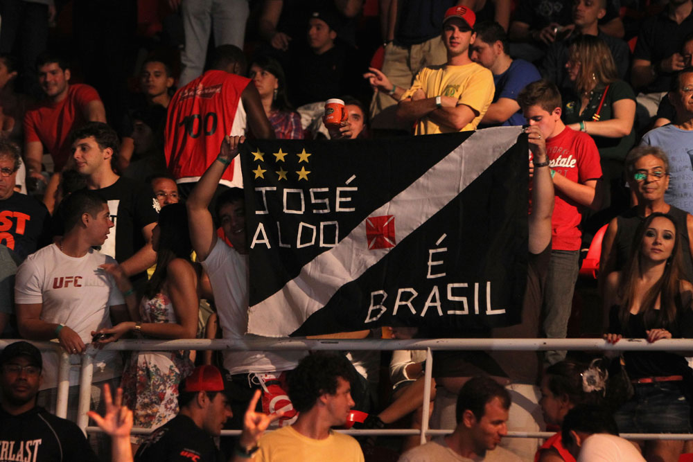 RIO DE JANEIRO, BRAZIL - JANUARY 14: Fans cheer prior to the Jose Aldo versus Chad Mendes featherweight bout during UFC 142 at HSBC Arena on January 14, 2012 in Rio de Janeiro, Brazil. (Photo by Josh Hedges/Zuffa LLC/Zuffa LLC via Getty Images)