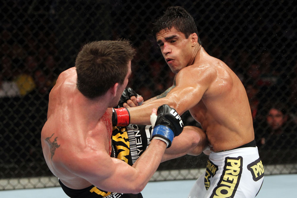 RIO DE JANEIRO, BRAZIL - JANUARY 14: Thiago Tavares (R) punches Sam Stout (L) in a lightweight bout during UFC 142 at HSBC Arena on January 14, 2012 in Rio de Janeiro, Brazil. (Photo by Josh Hedges/Zuffa LLC/Zuffa LLC via Getty Images)