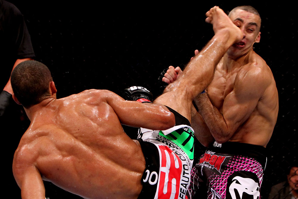 RIO DE JANEIRO, BRAZIL - JANUARY 14:  Edson Barboza (L) knocks out Terry Etim (R) with a spinning back kick in a lightweight bout during UFC 142 at HSBC Arena on January 14, 2012 in Rio de Janeiro, Brazil.  (Photo by Josh Hedges/Zuffa LLC/Zuffa LLC via Getty Images)