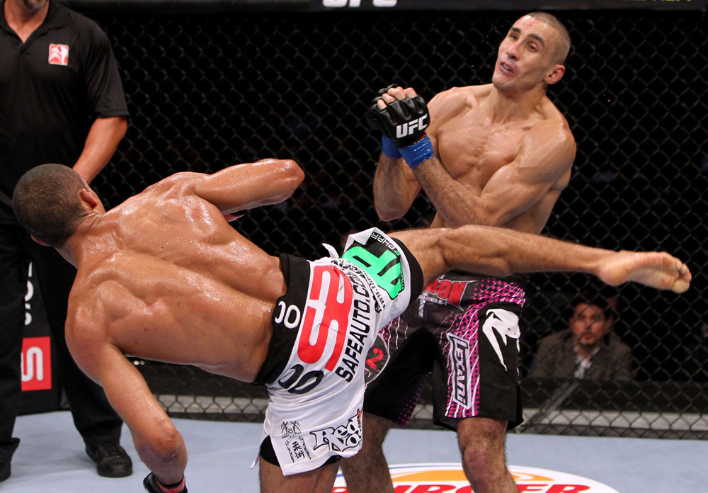 RIO DE JANEIRO, BRAZIL - JANUARY 14: Edson Barboza (L) knocks out Terry Etim (R) with a spinning back kick in a lightweight bout during UFC 142 at HSBC Arena on January 14, 2012 in Rio de Janeiro, Brazil. (Photo by Josh Hedges/Zuffa LLC/Zuffa LLC via Getty Images)
