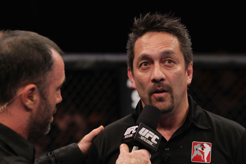 RIO DE JANEIRO, BRAZIL - JANUARY 14: Referee Mario Yamasaki (R) explains his decision for calling the welterweight bout between Erick Silva and Carlo Prater during UFC 142 at HSBC Arena on January 14, 2012 in Rio de Janeiro, Brazil. (Photo by Josh Hedges/Zuffa LLC/Zuffa LLC via Getty Images)