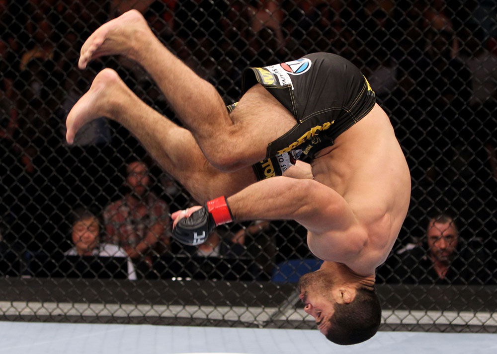 RIO DE JANEIRO, BRAZIL - JANUARY 14: Rousimar Palhares celebrates with a backflip after defeating Mike Massenzio in a middleweight bout during UFC 142 at HSBC Arena on January 14, 2012 in Rio de Janeiro, Brazil. (Photo by Josh Hedges/Zuffa LLC/Zuffa LLC via Getty Images)
