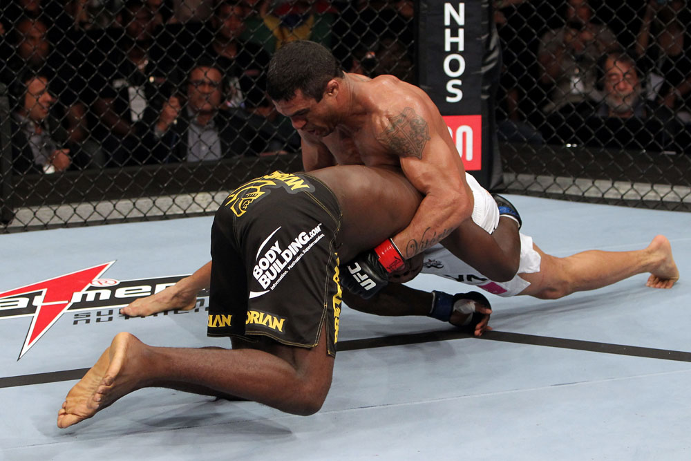 RIO DE JANEIRO, BRAZIL - JANUARY 14: Vitor Belfort (R) tries to takes down Anthony Johnson (L) in a middleweight bout during UFC 142 at HSBC Arena on January 14, 2012 in Rio de Janeiro, Brazil. (Photo by Josh Hedges/Zuffa LLC/Zuffa LLC via Getty Images)