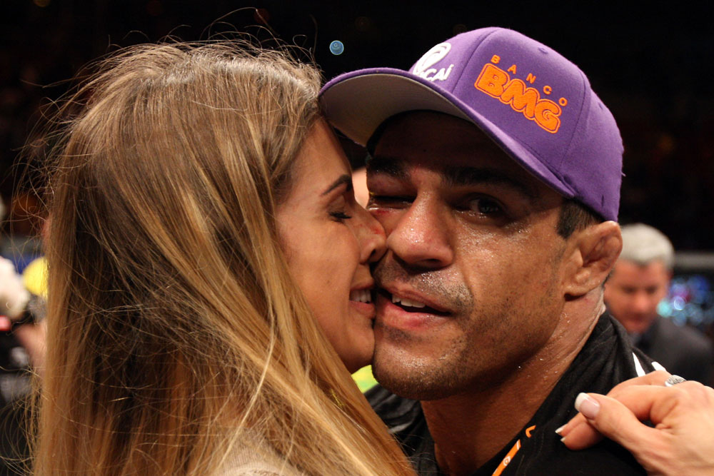 RIO DE JANEIRO, BRAZIL - JANUARY 14: Joana Prado (L) kisses her husband Vitor Belfort (R) after he defeated Anthony Johnson (not pictured) in a middleweight bout during UFC 142 at HSBC Arena on January 14, 2012 in Rio de Janeiro, Brazil. (Photo by Josh Hedges/Zuffa LLC/Zuffa LLC via Getty Images)