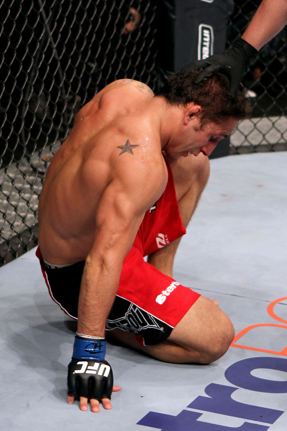 RIO DE JANEIRO, BRAZIL - JANUARY 14: Chad Mendes tries to get up after losing to Jose Aldo in a featherweight bout during UFC 142 at HSBC Arena on January 14, 2012 in Rio de Janeiro, Brazil. (Photo by Josh Hedges/Zuffa LLC/Zuffa LLC via Getty Images)