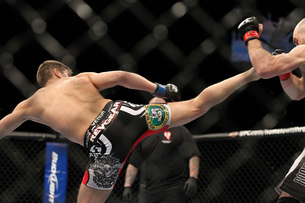 LAS VEGAS, NV - FEBRUARY 04:  Stephen Thompson (left) kicks Dan Stittgen during the UFC 143 event at Mandalay Bay Events Center on February 4, 2012 in Las Vegas, Nevada.  (Photo by Josh Hedges/Zuffa LLC/Zuffa LLC via Getty Images) *** Local Caption *** Stephen Thompson