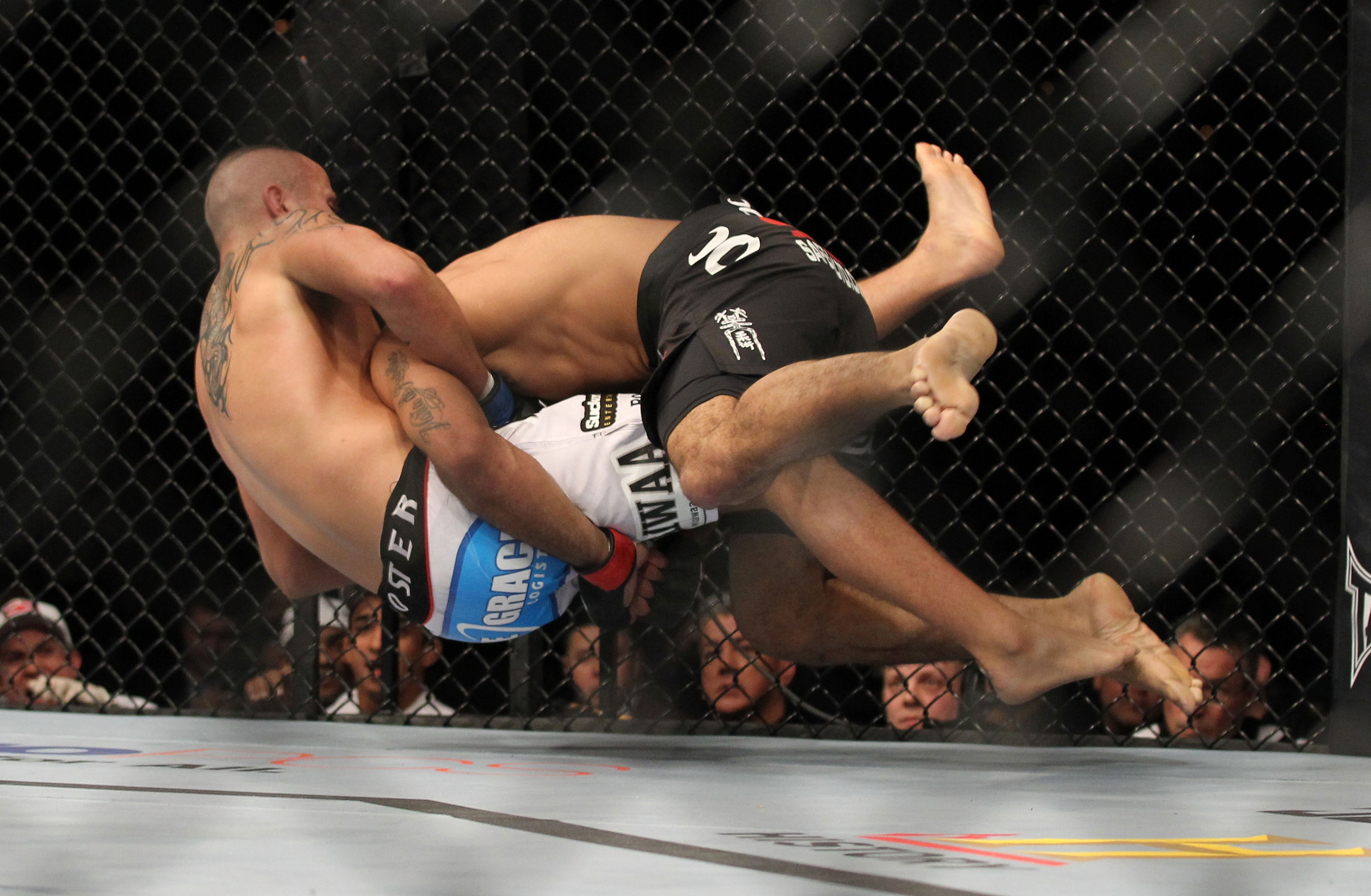 LAS VEGAS, NV - FEBRUARY 04:  Rafael Natal (black shorts) takes down Michael Kuiper during the UFC 143 event at Mandalay Bay Events Center on February 4, 2012 in Las Vegas, Nevada.  (Photo by Josh Hedges/Zuffa LLC/Zuffa LLC via Getty Images) *** Local Caption *** Rafael Natal; Michael Kuiper