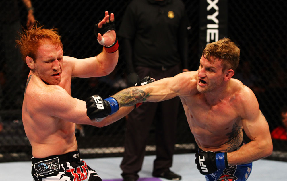 ATLANTA, GA - APRIL 21:  John Alessio (R) punches Mark Bocek during their lightweight bout for UFC 145 at Philips Arena on April 21, 2012 in Atlanta, Georgia.  (Photo by Al Bello/Zuffa LLC/Zuffa LLC via Getty Images)