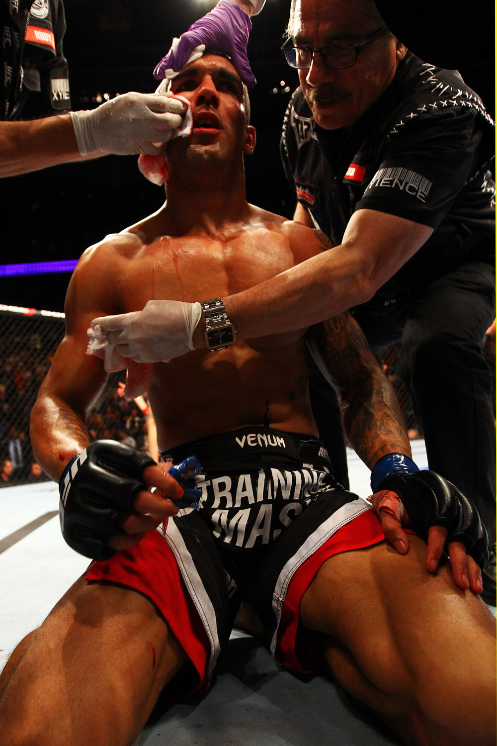 ATLANTA, GA - APRIL 21:  Che Mills receives medical attention after being defeated by Rory MacDonald by TKO during their welterweight bout for UFC 145 at Philips Arena on April 21, 2012 in Atlanta, Georgia.  (Photo by Al Bello/Zuffa LLC/Zuffa LLC via Getty Images)