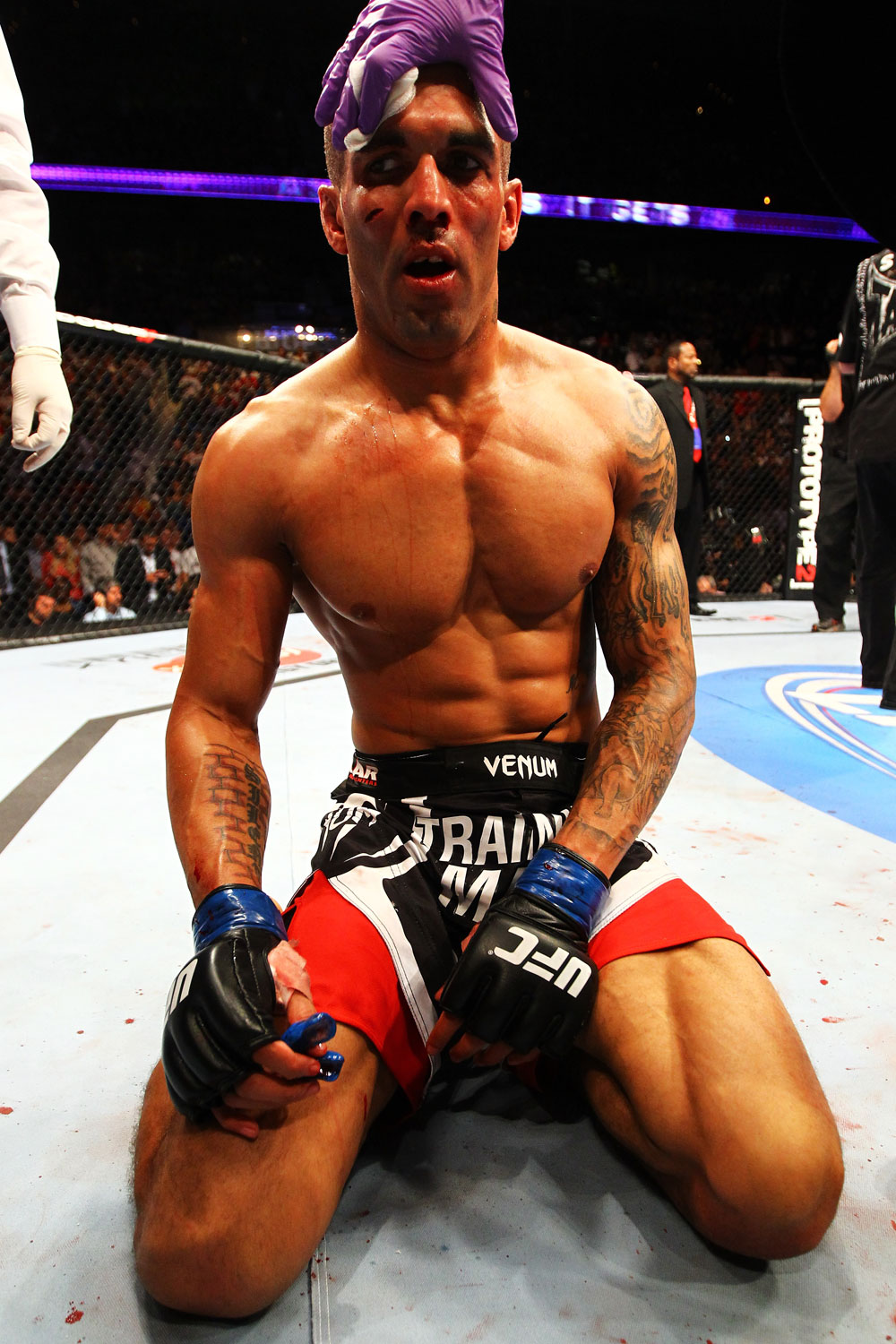 ATLANTA, GA - APRIL 21:  Che Mills receives medical attention after being defeated by Rory MacDonald by TKO during their welterweight bout for UFC 145 at Philips Arena on April 21, 2012 in Atlanta, Georgia.  (Photo by Al Bello/Zuffa LLC/Zuffa LLC via Getty Images)