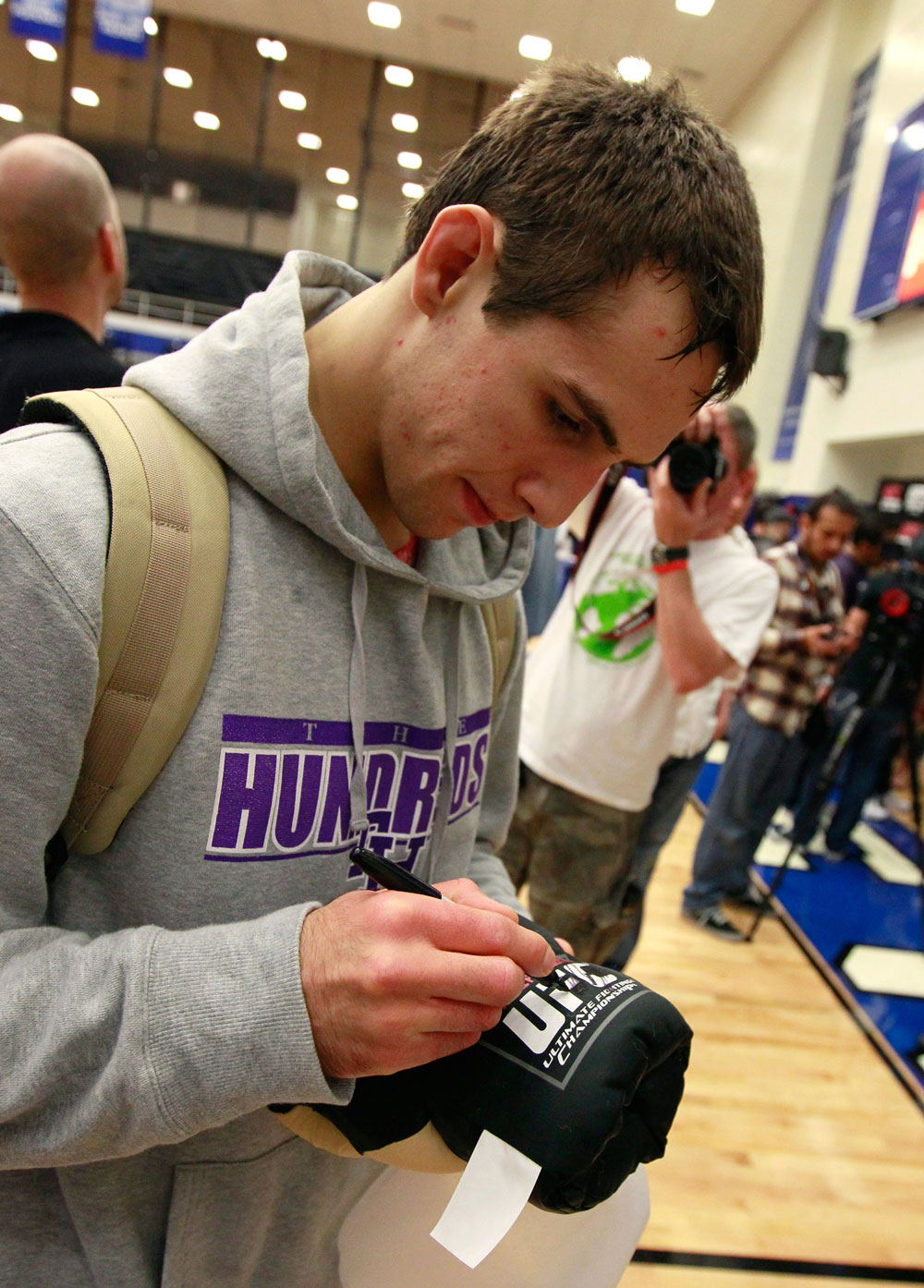 ATLANTA, GA - APRIL 19: Rory MacDonald of Canada signs autographs after working out for the media during UFC 145 open workouts at GSU Sports Arena on April 19, 2012 in Atlanta, Georgia. (Photo by Kevin C. Cox/Zuffa LLC/Zuffa LLC via Getty Images)