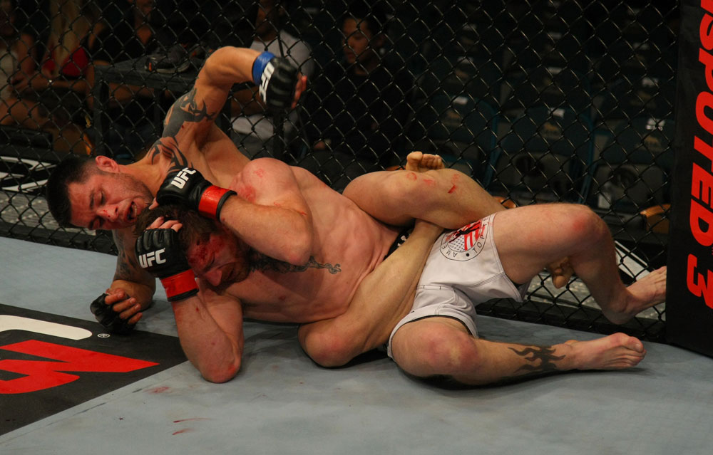 LAS VEGAS, NV - MAY 26:  Daniel Pineda (top) punches Mike Brown on the ground during a featherweight bout at UFC 146 at MGM Grand Garden Arena on May 26, 2012 in Las Vegas, Nevada.  (Photo by Donald Miralle/Zuffa LLC/Zuffa LLC via Getty Images)
