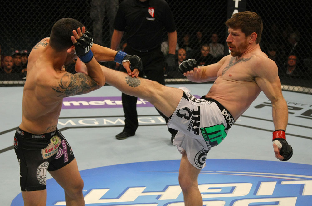 LAS VEGAS, NV - MAY 26:  (R-L) Mike Brown kicks Daniel Pineda during a light featherweight bout at UFC 146 at MGM Grand Garden Arena on May 26, 2012 in Las Vegas, Nevada.  (Photo by Donald Miralle/Zuffa LLC/Zuffa LLC via Getty Images)