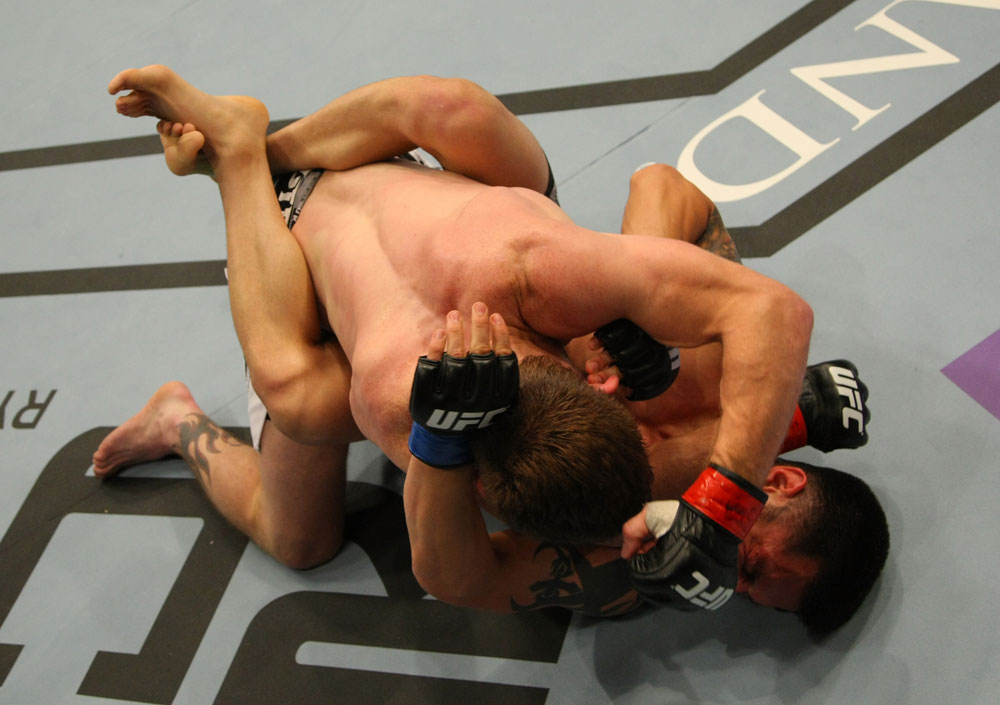 LAS VEGAS, NV - MAY 26:  Mike Brown (top) punches Daniel Pineda on the ground during a featherweight bout at UFC 146 at MGM Grand Garden Arena on May 26, 2012 in Las Vegas, Nevada.  (Photo by Donald Miralle/Zuffa LLC/Zuffa LLC via Getty Images)
