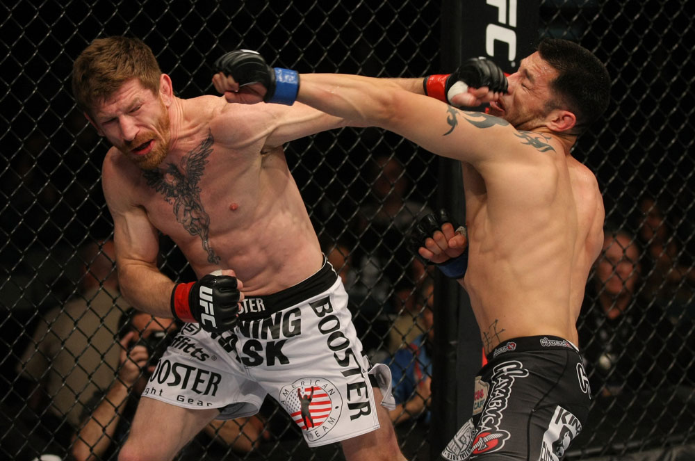 LAS VEGAS, NV - MAY 26:  (L-R) Mike Brown and Daniel Pineda exchange punches during a light featherweight bout at UFC 146 at MGM Grand Garden Arena on May 26, 2012 in Las Vegas, Nevada.  (Photo by Donald Miralle/Zuffa LLC/Zuffa LLC via Getty Images)