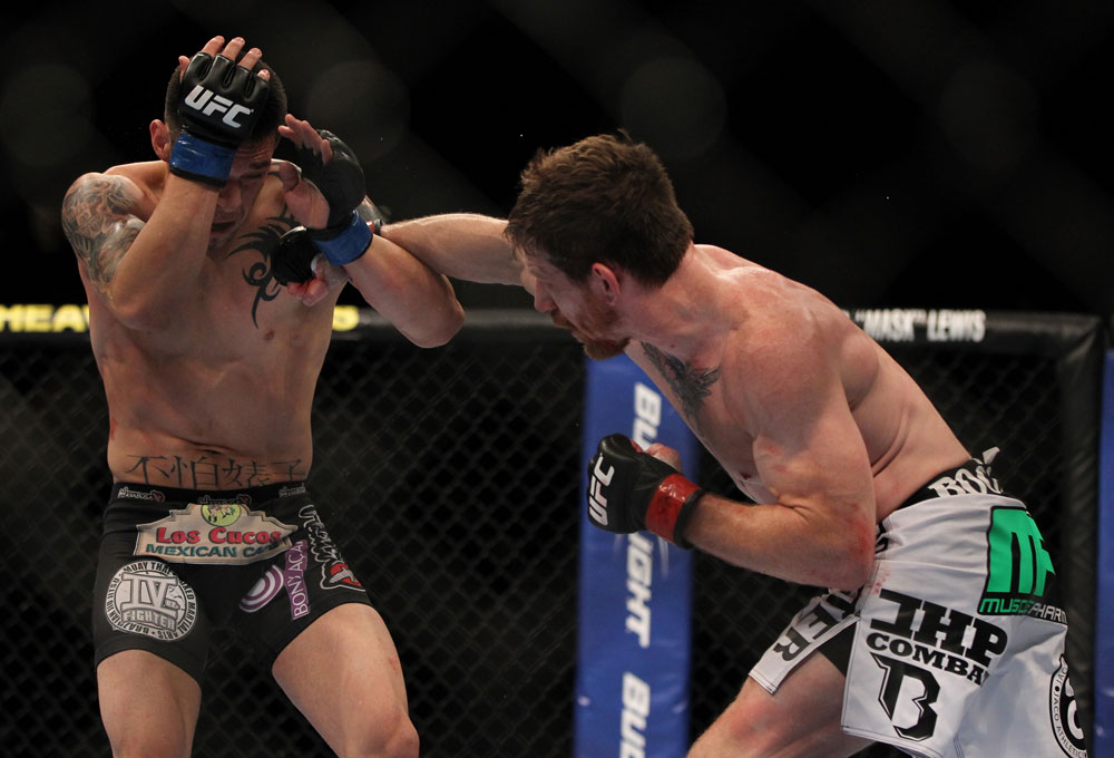 LAS VEGAS, NV - MAY 26:  (R-L) Mike Brown punches Daniel Pineda during a light featherweight bout at UFC 146 at MGM Grand Garden Arena on May 26, 2012 in Las Vegas, Nevada.  (Photo by Josh Hedges/Zuffa LLC/Zuffa LLC via Getty Images)