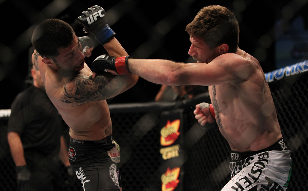 LAS VEGAS, NV - MAY 26:  Mike Brown (right) punches Daniel Pineda during a light featherweight bout at UFC 146 at MGM Grand Garden Arena on May 26, 2012 in Las Vegas, Nevada.  (Photo by Josh Hedges/Zuffa LLC/Zuffa LLC via Getty Images)