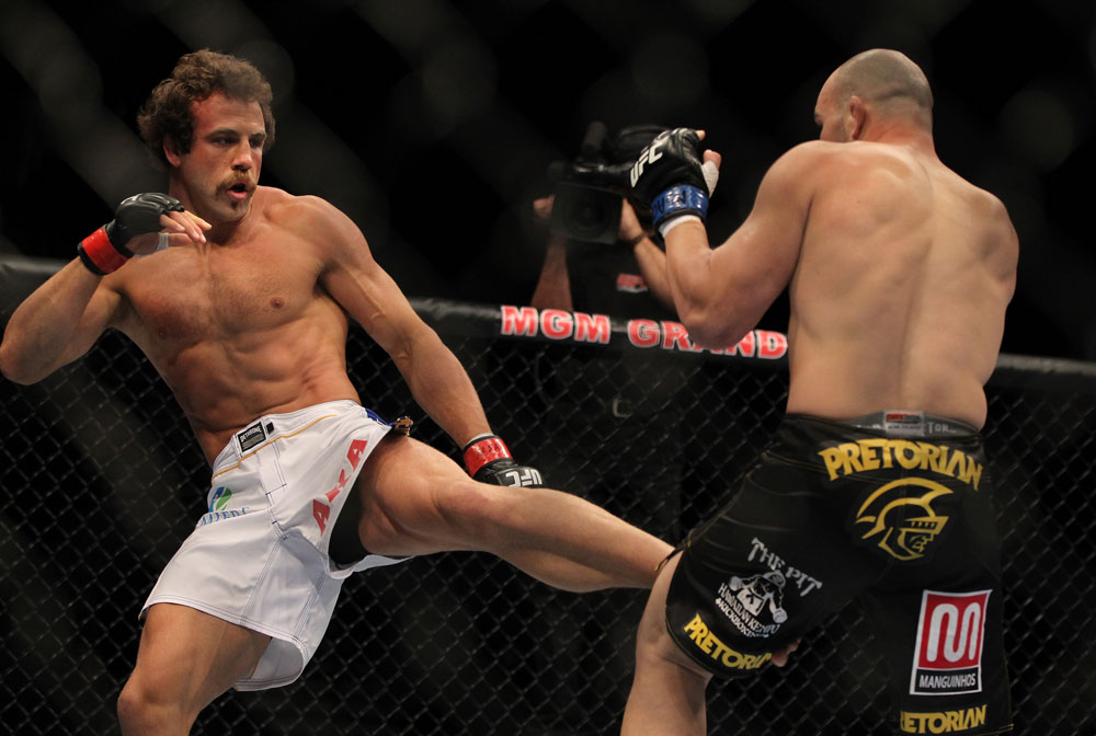 LAS VEGAS, NV - MAY 26:  Kyle Kingsbury (left) kicks Glover Teixeira during a light heavyweight bout at UFC 146 at MGM Grand Garden Arena on May 26, 2012 in Las Vegas, Nevada.  (Photo by Josh Hedges/Zuffa LLC/Zuffa LLC via Getty Images)