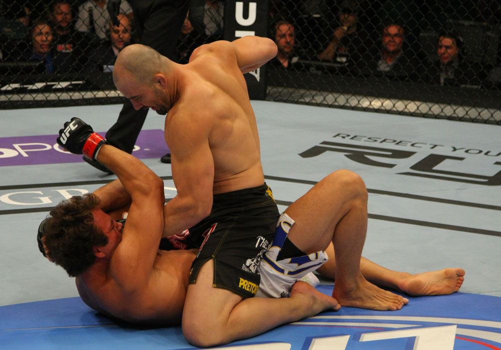 LAS VEGAS, NV - MAY 26:  Glover Teixeira (top) punches Kyle Kingsbury during a light heavyweight bout at UFC 146 at MGM Grand Garden Arena on May 26, 2012 in Las Vegas, Nevada.  (Photo by Donald Miralle/Zuffa LLC/Zuffa LLC via Getty Images)
