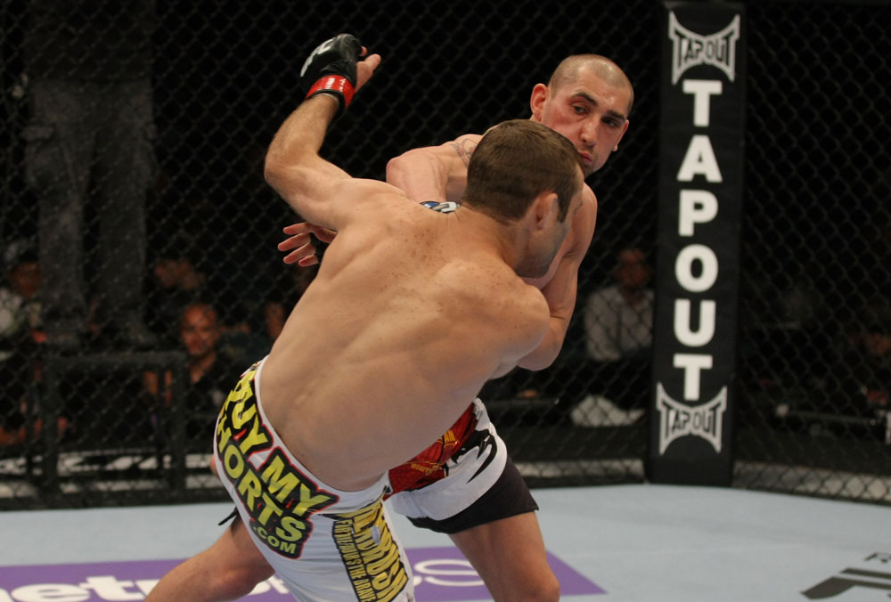 LAS VEGAS, NV - MAY 26:  Paul Sass punches Jacob Volkmann during a welterweight bout at UFC 146 at MGM Grand Garden Arena on May 26, 2012 in Las Vegas, Nevada.  (Photo by Donald Miralle/Zuffa LLC/Zuffa LLC via Getty Images)