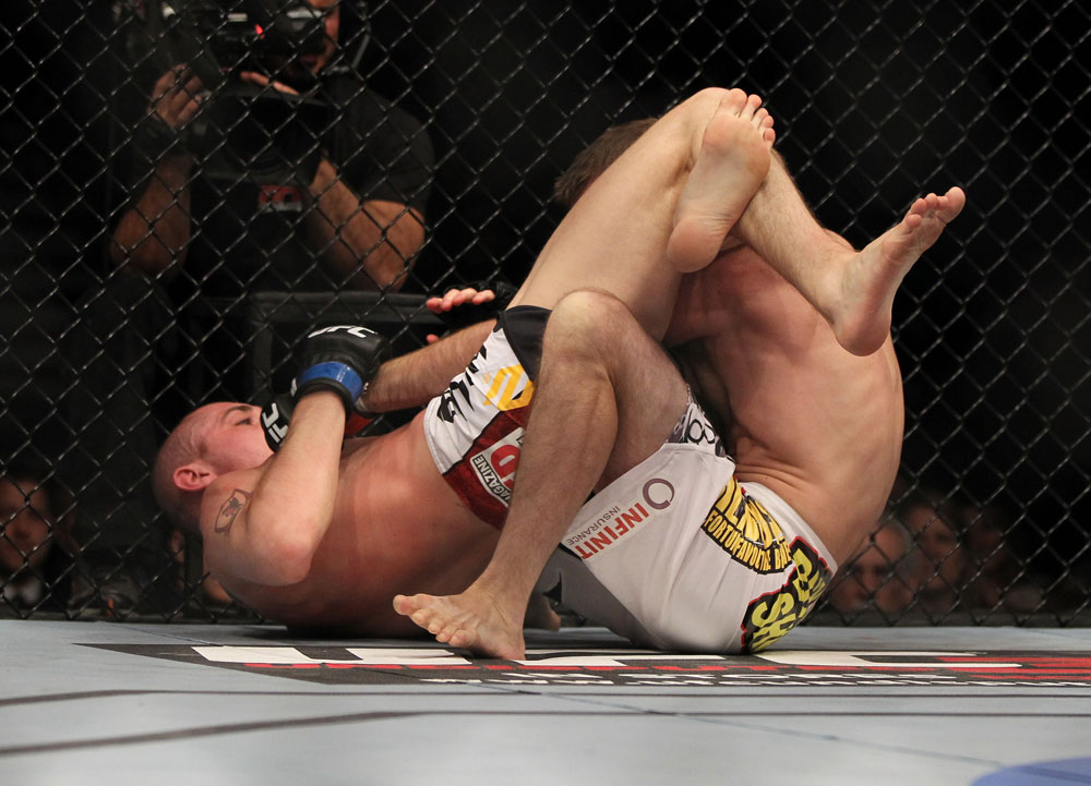 LAS VEGAS, NV - MAY 26:  Paul Sass (left) attempts to submit Jacob Volkmann during a lightweight bout at UFC 146 at MGM Grand Garden Arena on May 26, 2012 in Las Vegas, Nevada.  (Photo by Josh Hedges/Zuffa LLC/Zuffa LLC via Getty Images)