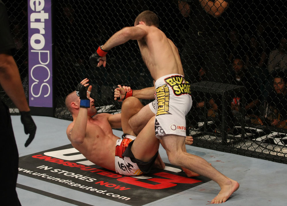 LAS VEGAS, NV - MAY 26:  Jacob Volkmann (white shorts) leans in to punch Paul Sass during a lightweight bout at UFC 146 at MGM Grand Garden Arena on May 26, 2012 in Las Vegas, Nevada.  (Photo by Donald Miralle/Zuffa LLC/Zuffa LLC via Getty Images)