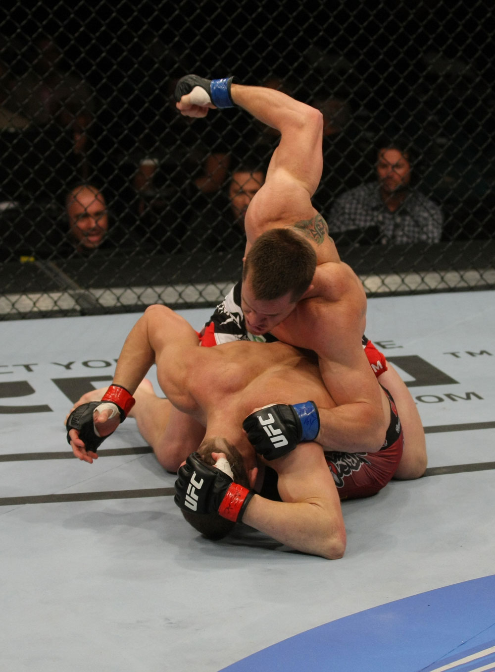 LAS VEGAS, NV - MAY 26:  CB Dollaway (top) punches Jason Miller during a middleweight bout at UFC 146 at MGM Grand Garden Arena on May 26, 2012 in Las Vegas, Nevada.  (Photo by Donald Miralle/Zuffa LLC/Zuffa LLC via Getty Images)