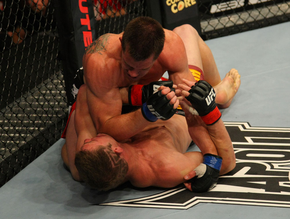LAS VEGAS, NV - MAY 26:  CB Dollaway (top) punches Jason Miller during a middleweight bout at UFC 146 at MGM Grand Garden Arena on May 26, 2012 in Las Vegas, Nevada.  (Photo by Donald Miralle/Zuffa LLC/Zuffa LLC via Getty Images)