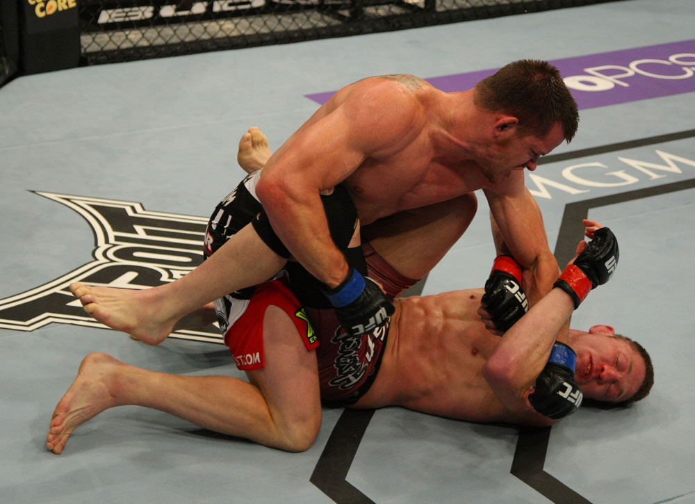 LAS VEGAS, NV - MAY 26:  CB Dollaway (top) punches Jason Miller during a middleweight bout at UFC 146 at MGM Grand Garden Arena on May 26, 2012 in Las Vegas, Nevada.  (Photo by Donald Miralle/Zuffa LLC/Zuffa LLC via Getty Images)