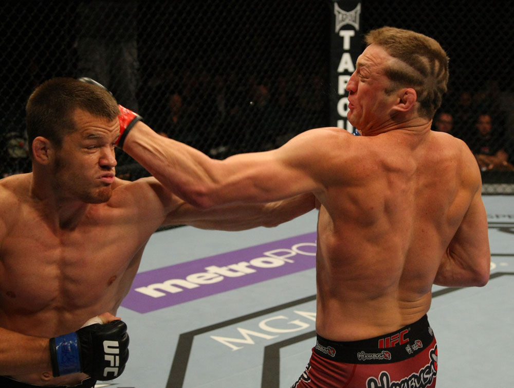 LAS VEGAS, NV - MAY 26:  CB Dollaway (L) punches Jason Miller during a middleweight bout at UFC 146 at MGM Grand Garden Arena on May 26, 2012 in Las Vegas, Nevada.  (Photo by Donald Miralle/Zuffa LLC/Zuffa LLC via Getty Images)