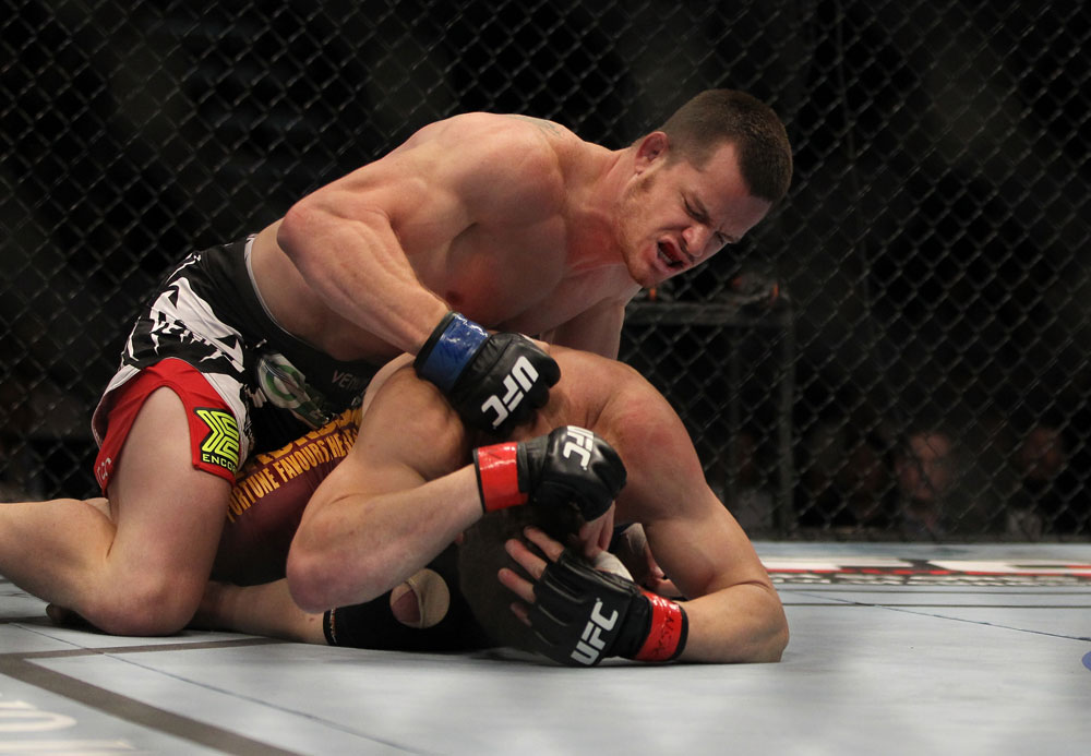 LAS VEGAS, NV - MAY 26:  CB Dollaway (top) punches Jason Miller during a middleweight bout at UFC 146 at MGM Grand Garden Arena on May 26, 2012 in Las Vegas, Nevada.  (Photo by Josh Hedges/Zuffa LLC/Zuffa LLC via Getty Images)