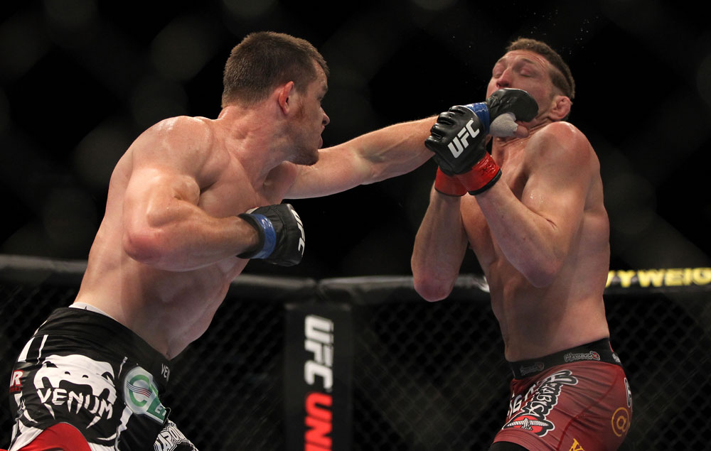 LAS VEGAS, NV - MAY 26:  CB Dollaway (left) punches Jason Miller during a middleweight bout at UFC 146 at MGM Grand Garden Arena on May 26, 2012 in Las Vegas, Nevada.  (Photo by Josh Hedges/Zuffa LLC/Zuffa LLC via Getty Images)