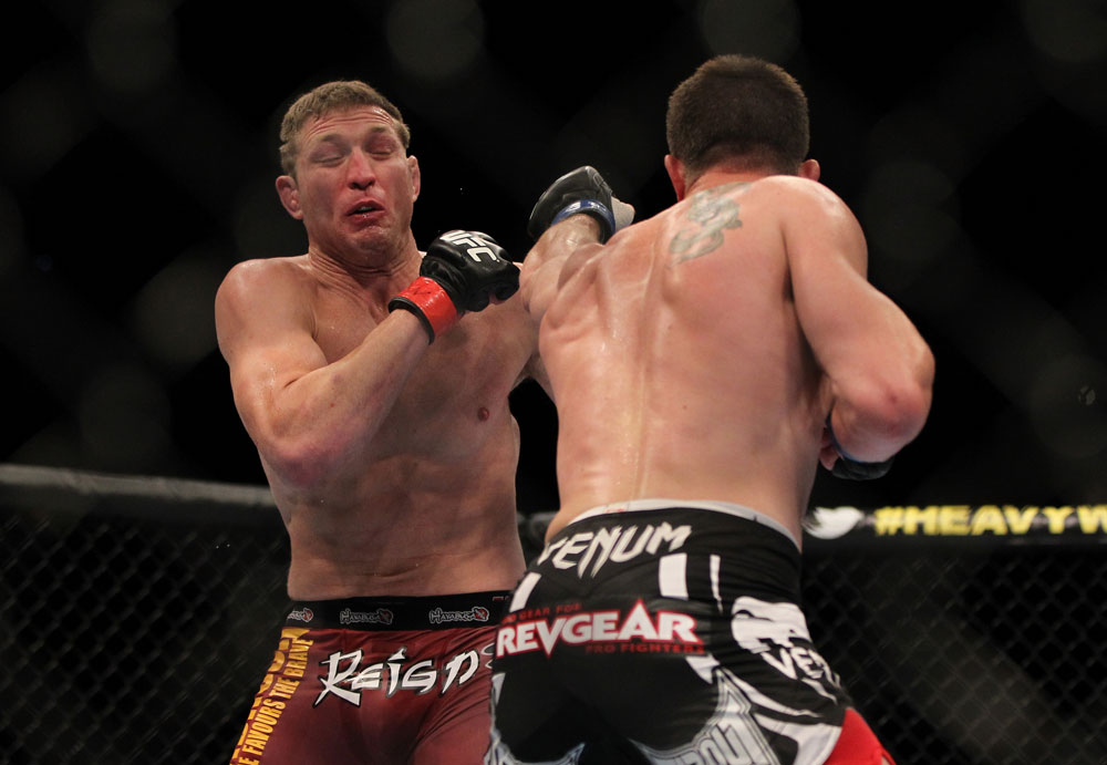 LAS VEGAS, NV - MAY 26:  CB Dollaway (right) punches Jason Miller during a middleweight bout at UFC 146 at MGM Grand Garden Arena on May 26, 2012 in Las Vegas, Nevada.  (Photo by Josh Hedges/Zuffa LLC/Zuffa LLC via Getty Images)