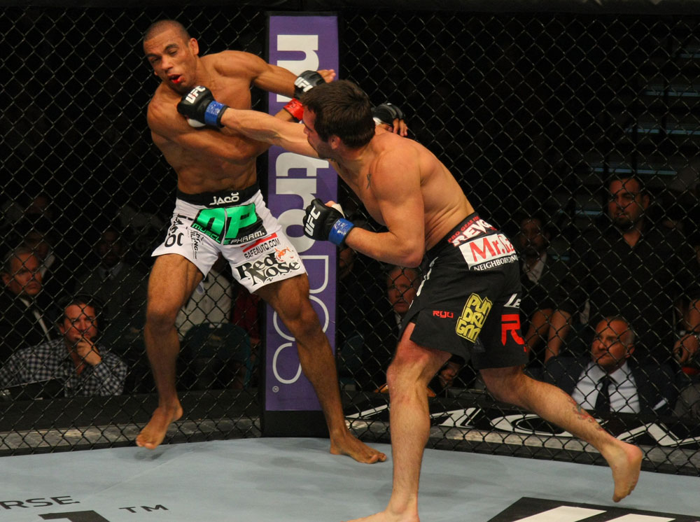 LAS VEGAS, NV - MAY 26:  Jamie Varner (R) punches Edson Barboza during a lightweight bout at UFC 146 at MGM Grand Garden Arena on May 26, 2012 in Las Vegas, Nevada.  (Photo by Donald Miralle/Zuffa LLC/Zuffa LLC via Getty Images)