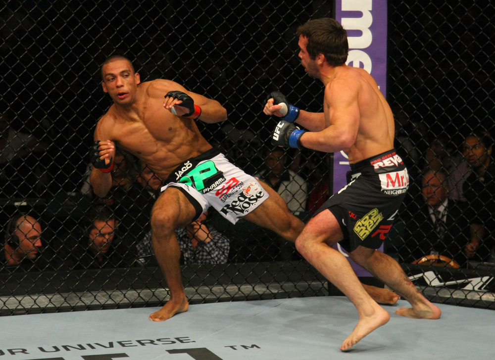 LAS VEGAS, NV - MAY 26:  Jamie Varner (R) pursues Edson Barboza after a punch during a lightweight bout at UFC 146 at MGM Grand Garden Arena on May 26, 2012 in Las Vegas, Nevada.  (Photo by Donald Miralle/Zuffa LLC/Zuffa LLC via Getty Images)