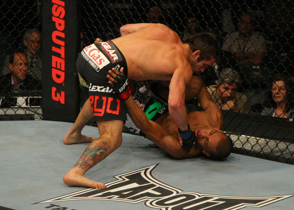 LAS VEGAS, NV - MAY 26:  Jamie Varner (top) punches Edson Barboza during a lightweight bout at UFC 146 at MGM Grand Garden Arena on May 26, 2012 in Las Vegas, Nevada.  (Photo by Donald Miralle/Zuffa LLC/Zuffa LLC via Getty Images)