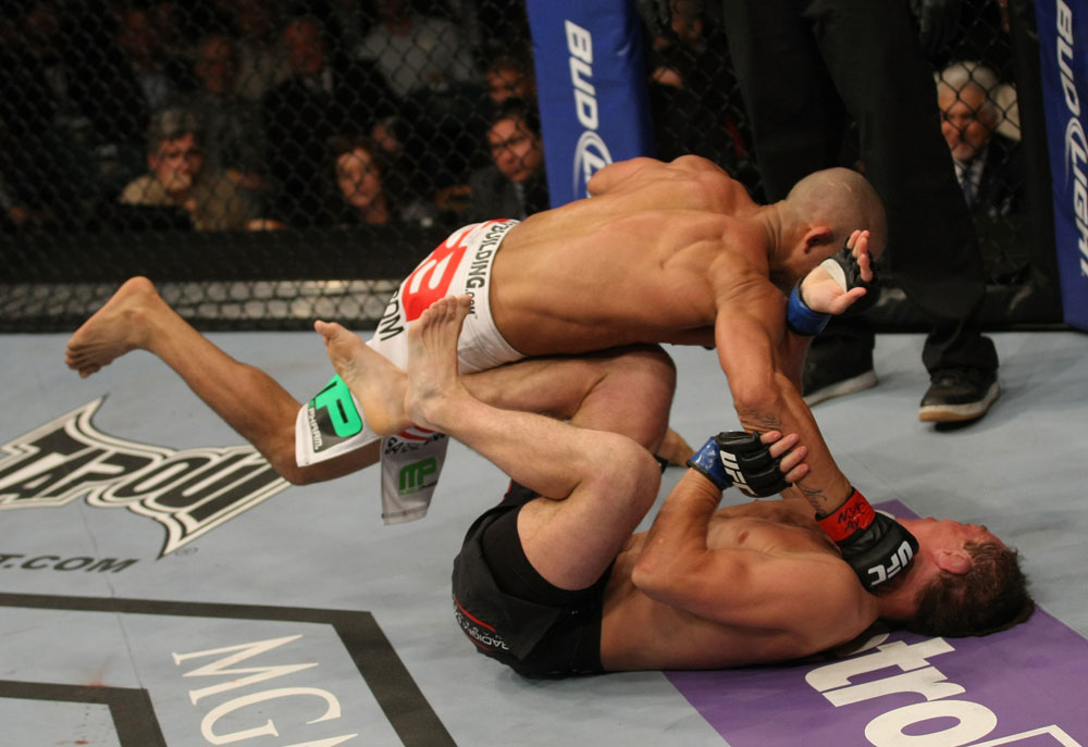 LAS VEGAS, NV - MAY 26:  Diego Brandao (top) punches Darren Elkins during a featherweight bout at UFC 146 at MGM Grand Garden Arena on May 26, 2012 in Las Vegas, Nevada.  (Photo by Donald Miralle/Zuffa LLC/Zuffa LLC via Getty Images)