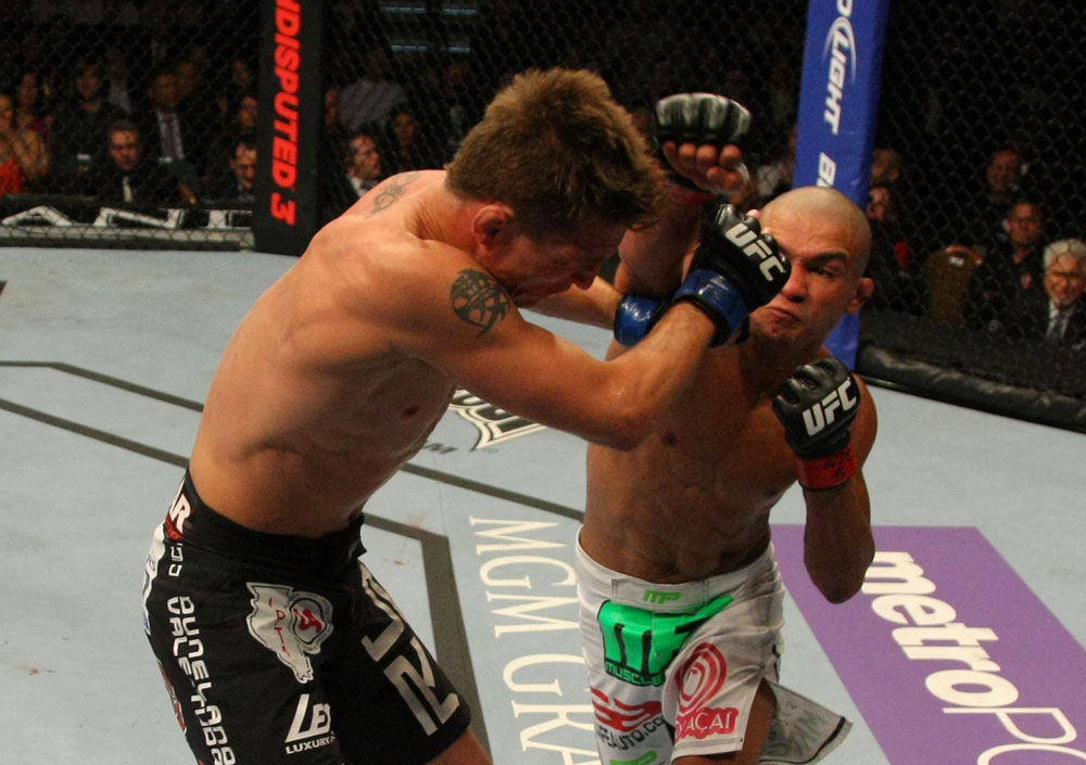 LAS VEGAS, NV - MAY 26:  Diego Brandao (R) punches Darren Elkins during a featherweight bout at UFC 146 at MGM Grand Garden Arena on May 26, 2012 in Las Vegas, Nevada.  (Photo by Donald Miralle/Zuffa LLC/Zuffa LLC via Getty Images)