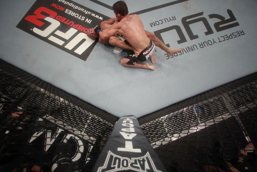 LAS VEGAS, NV - MAY 26:  Darren Elkins (R) punches Diego Brandao during a featherweight bout at UFC 146 at MGM Grand Garden Arena on May 26, 2012 in Las Vegas, Nevada.  (Photo by Donald Miralle/Zuffa LLC/Zuffa LLC via Getty Images)