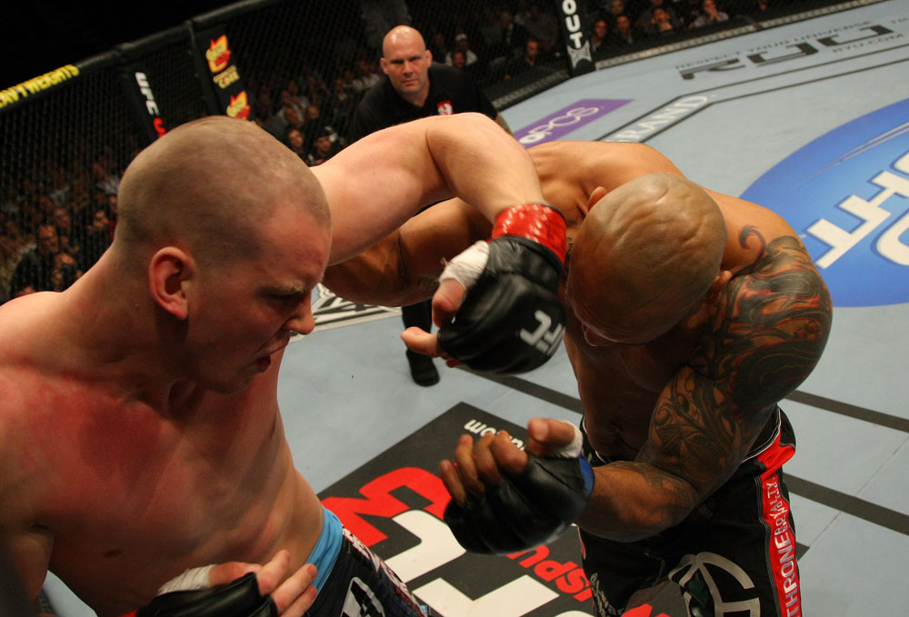 LAS VEGAS, NV - MAY 26:  Stefan Struve (L) punches Lavar Johnson during a heavyweight bout at UFC 146 at MGM Grand Garden Arena on May 26, 2012 in Las Vegas, Nevada.  (Photo by Donald Miralle/Zuffa LLC/Zuffa LLC via Getty Images)